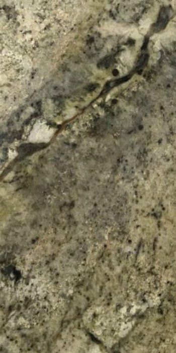 A close up of a rock with a few holes in it.