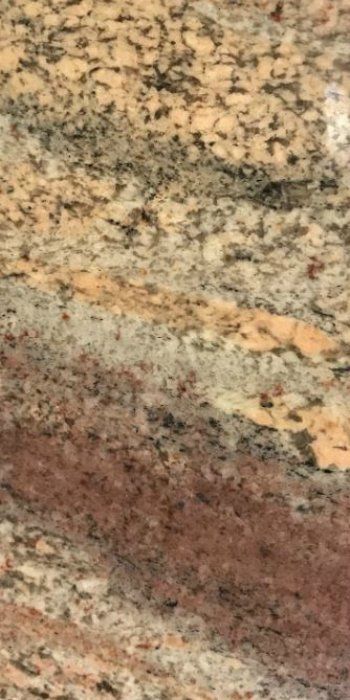 A close up of a carpet with a multicolored pattern.