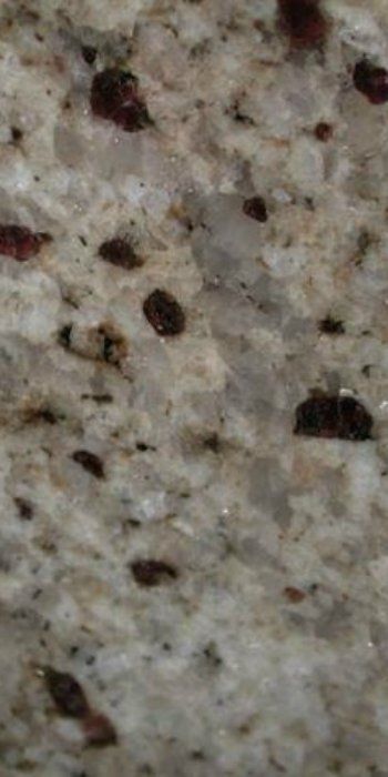 A close up of a marble counter top with a lot of small stones on it.