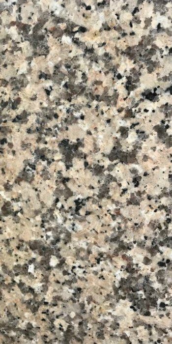 A close up of a granite counter top with a lot of small stones on it.