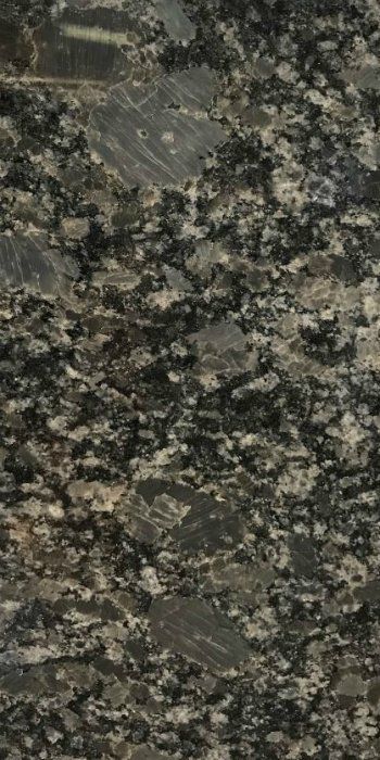 A close up of a black granite counter top.
