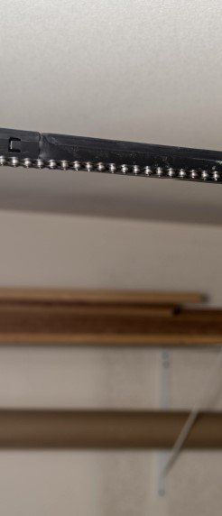Black chain of a garage door opener.