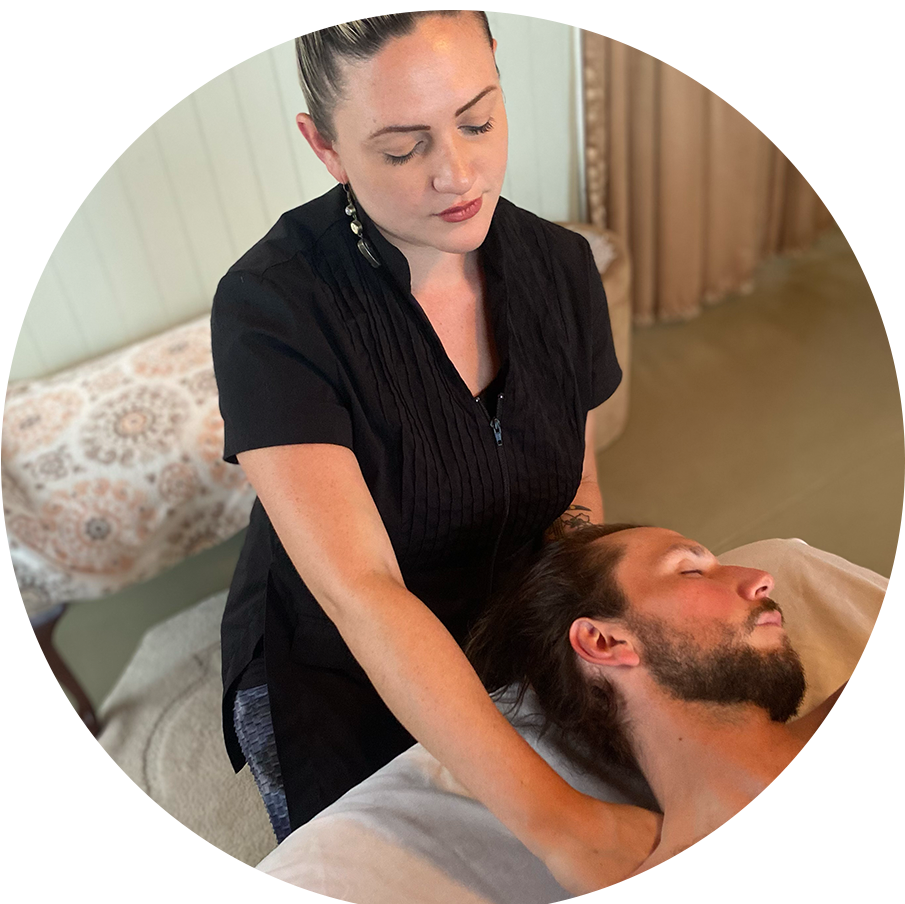 A man is laying on a bed getting a massage from a doctor.