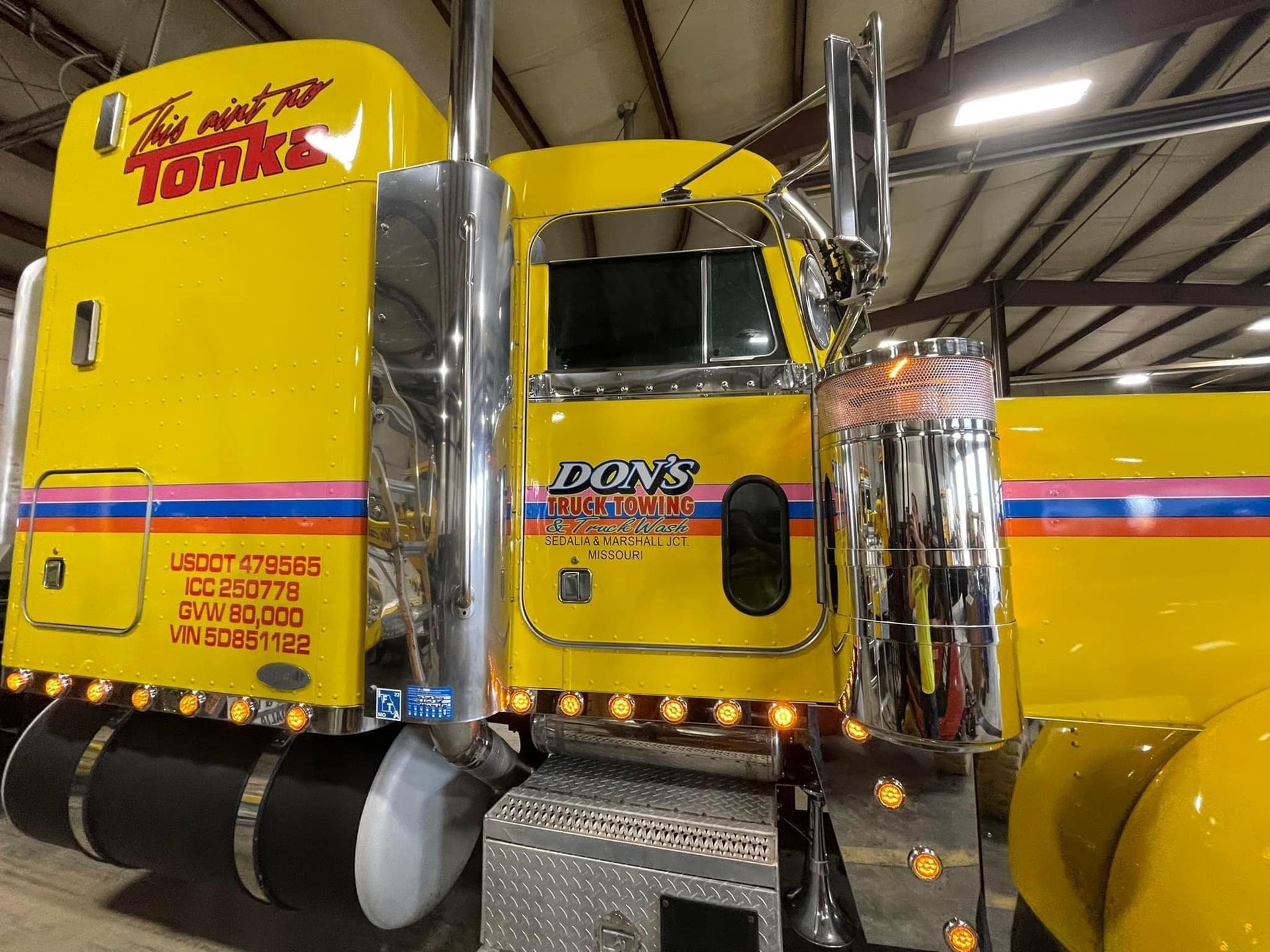 Yellow semi-truck with chrome accents, and 