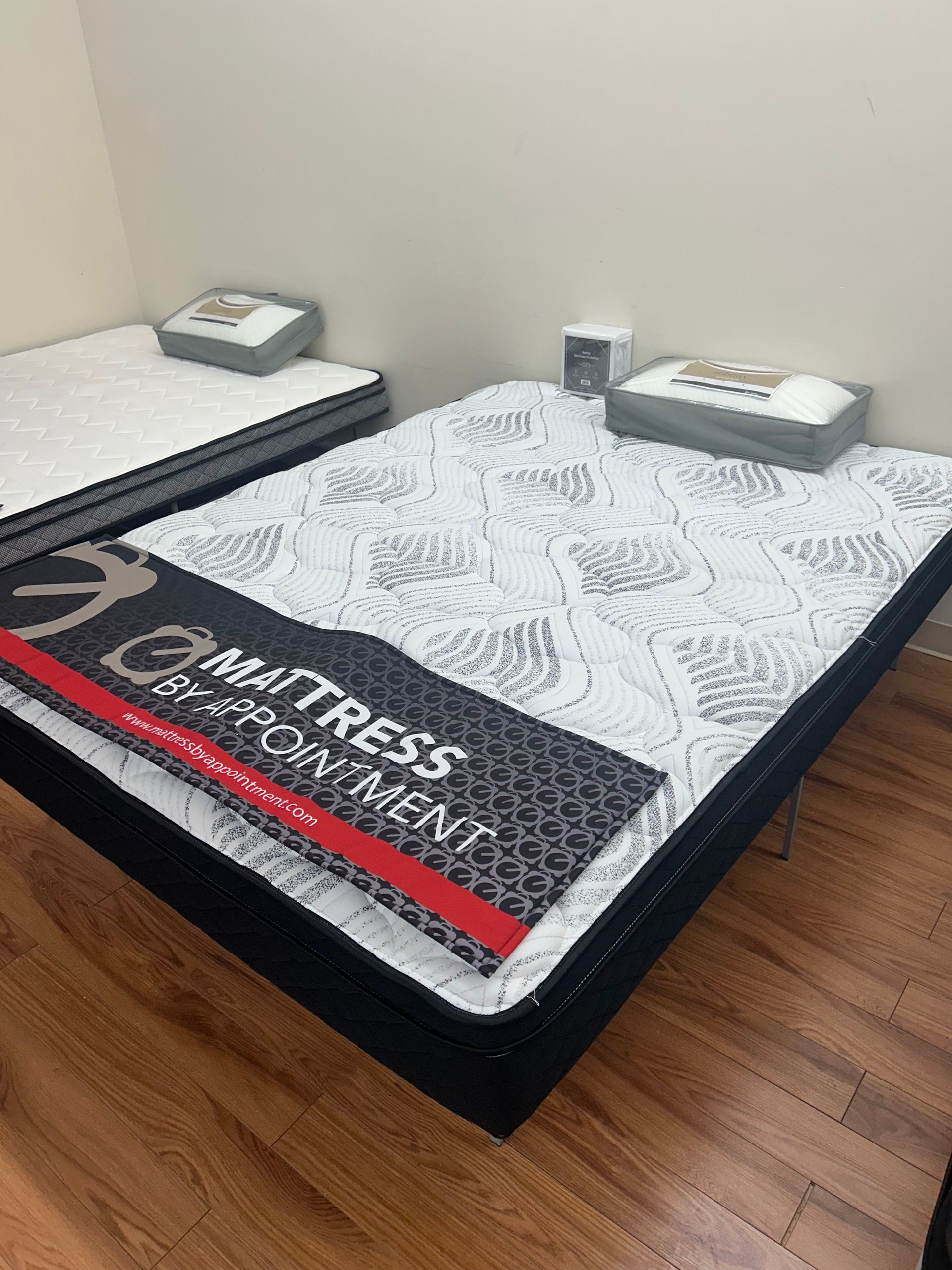 Two mattresses on display in a store