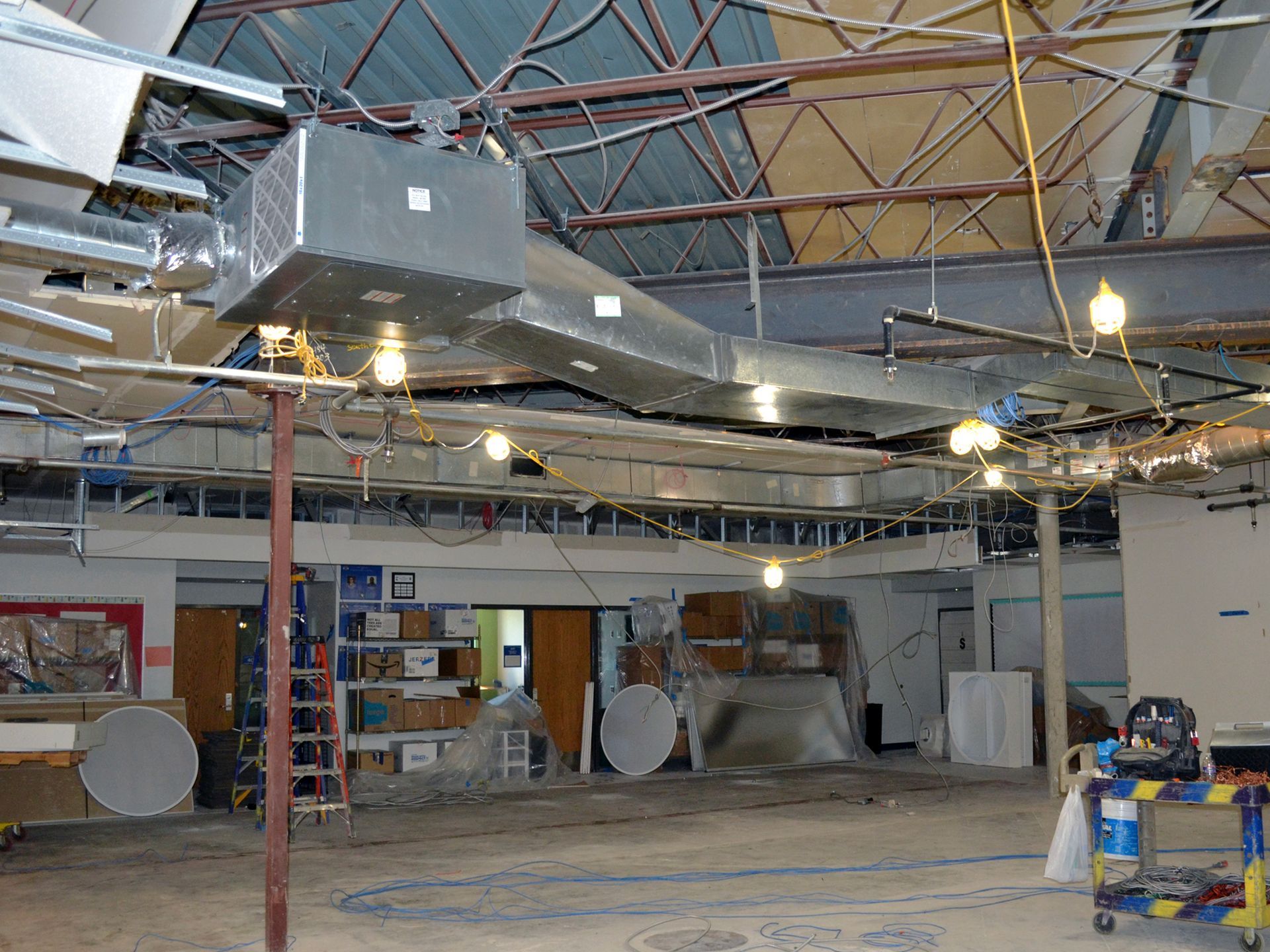 A large room with a lot of wires hanging from the ceiling