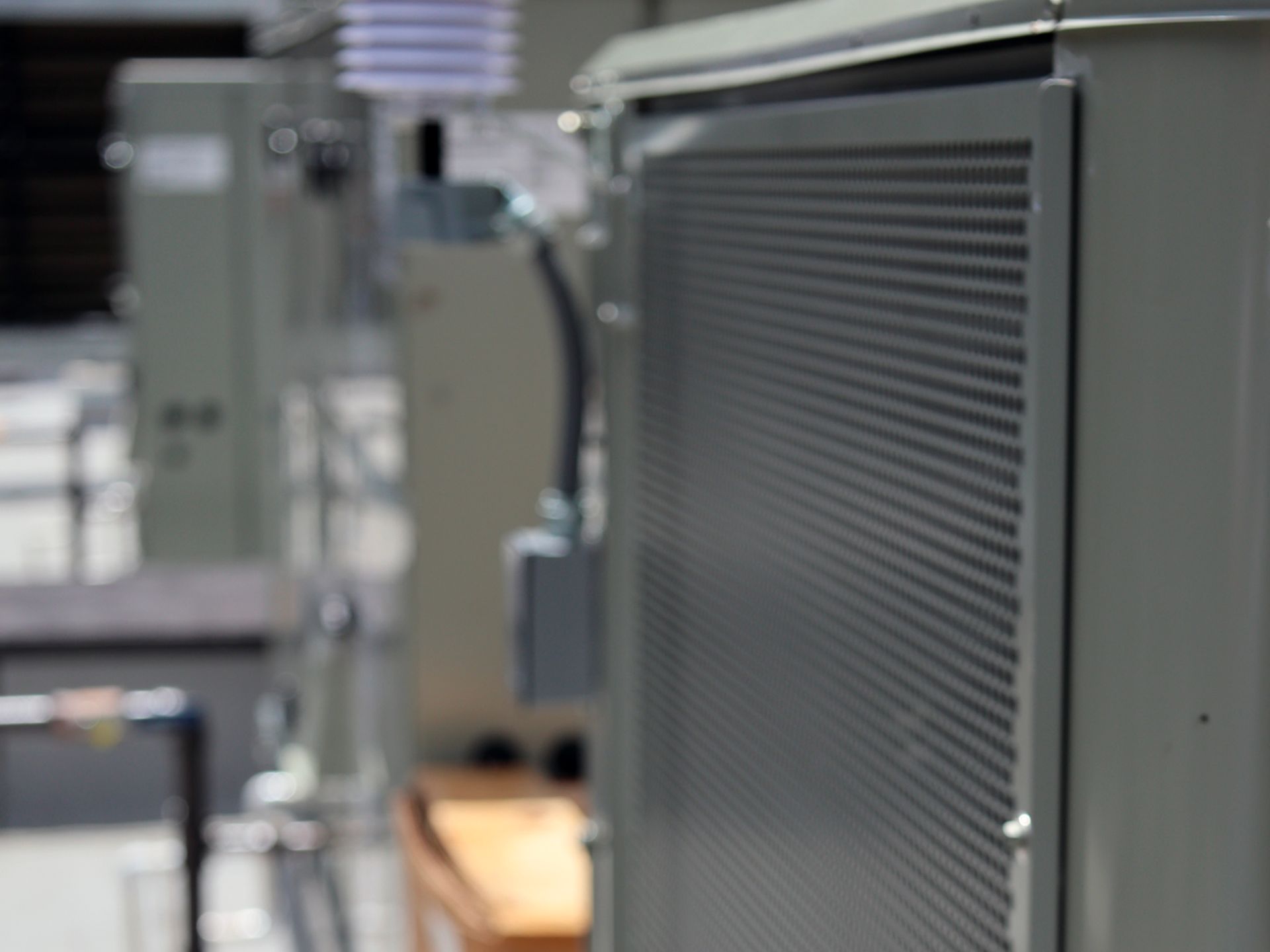 A close up of a gray electrical box in a room.