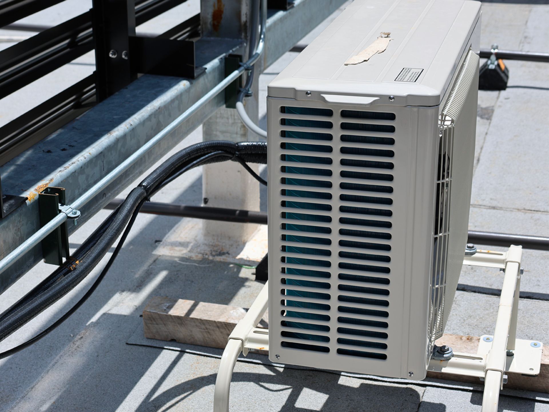 An air conditioner is sitting on the roof of a building