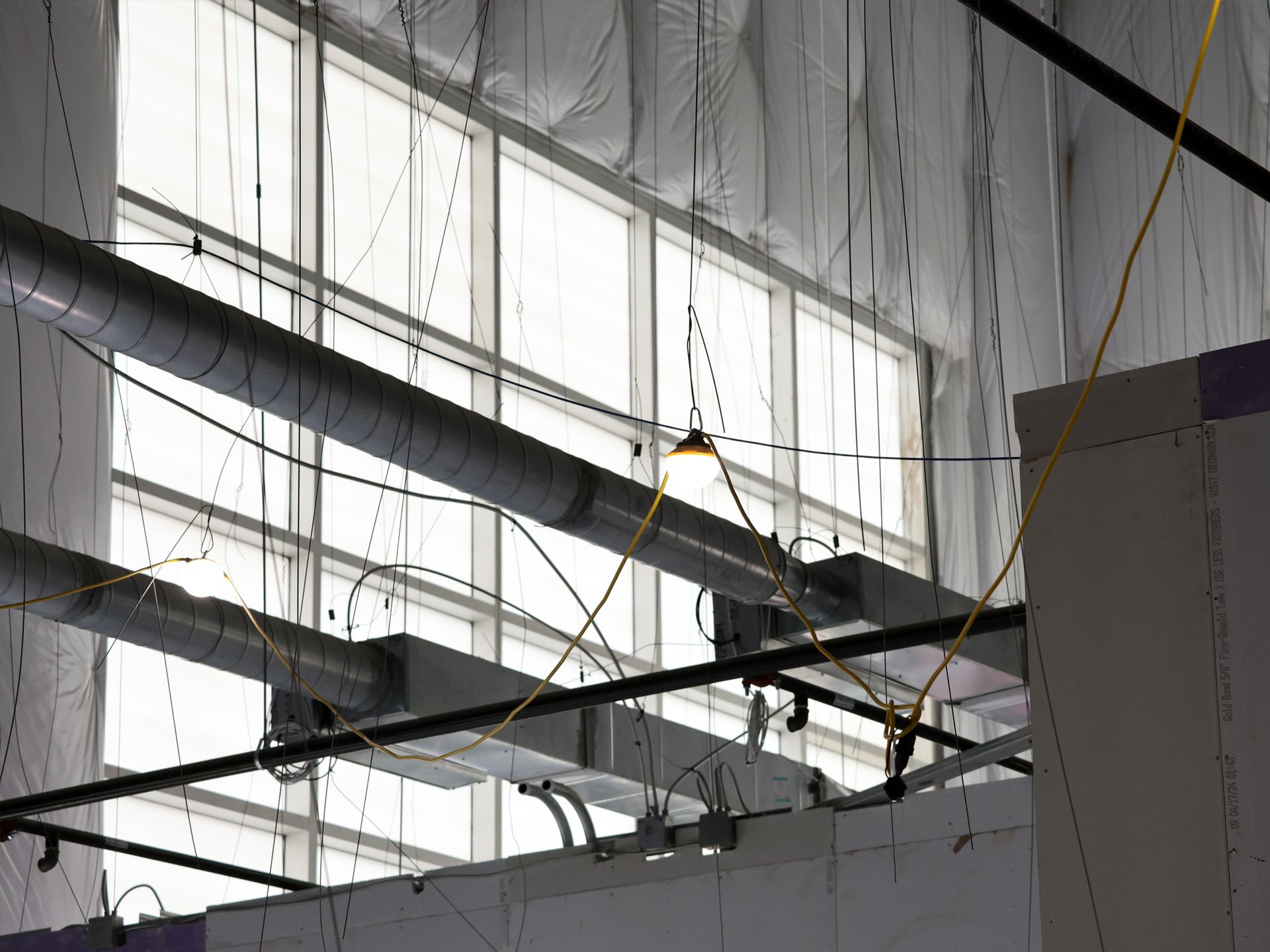 A building with a lot of pipes hanging from the ceiling