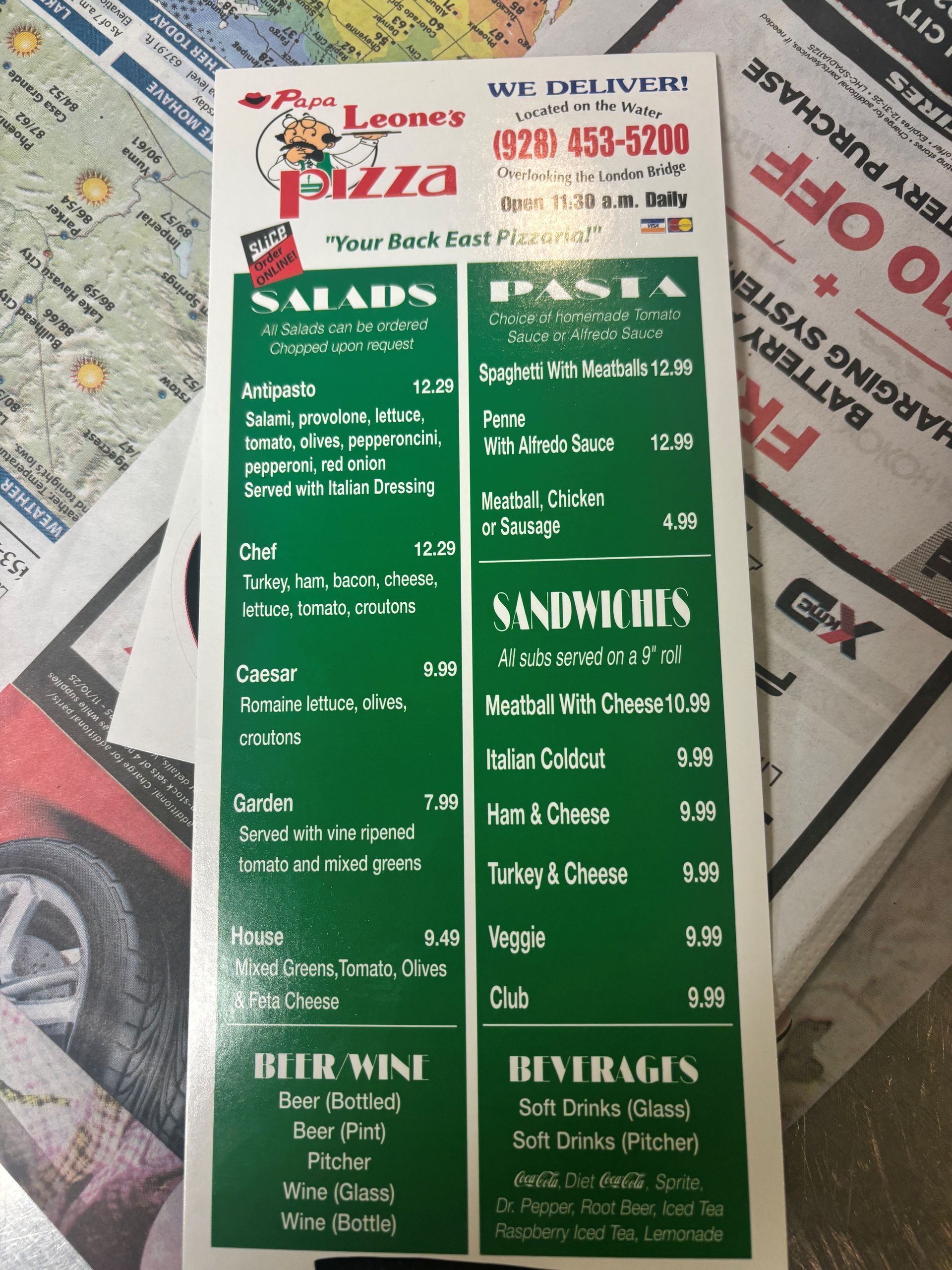 Menu for Lepone's Pizza, offering salads, pasta, sandwiches, beer/wine, and beverages; green and white text on a black background.