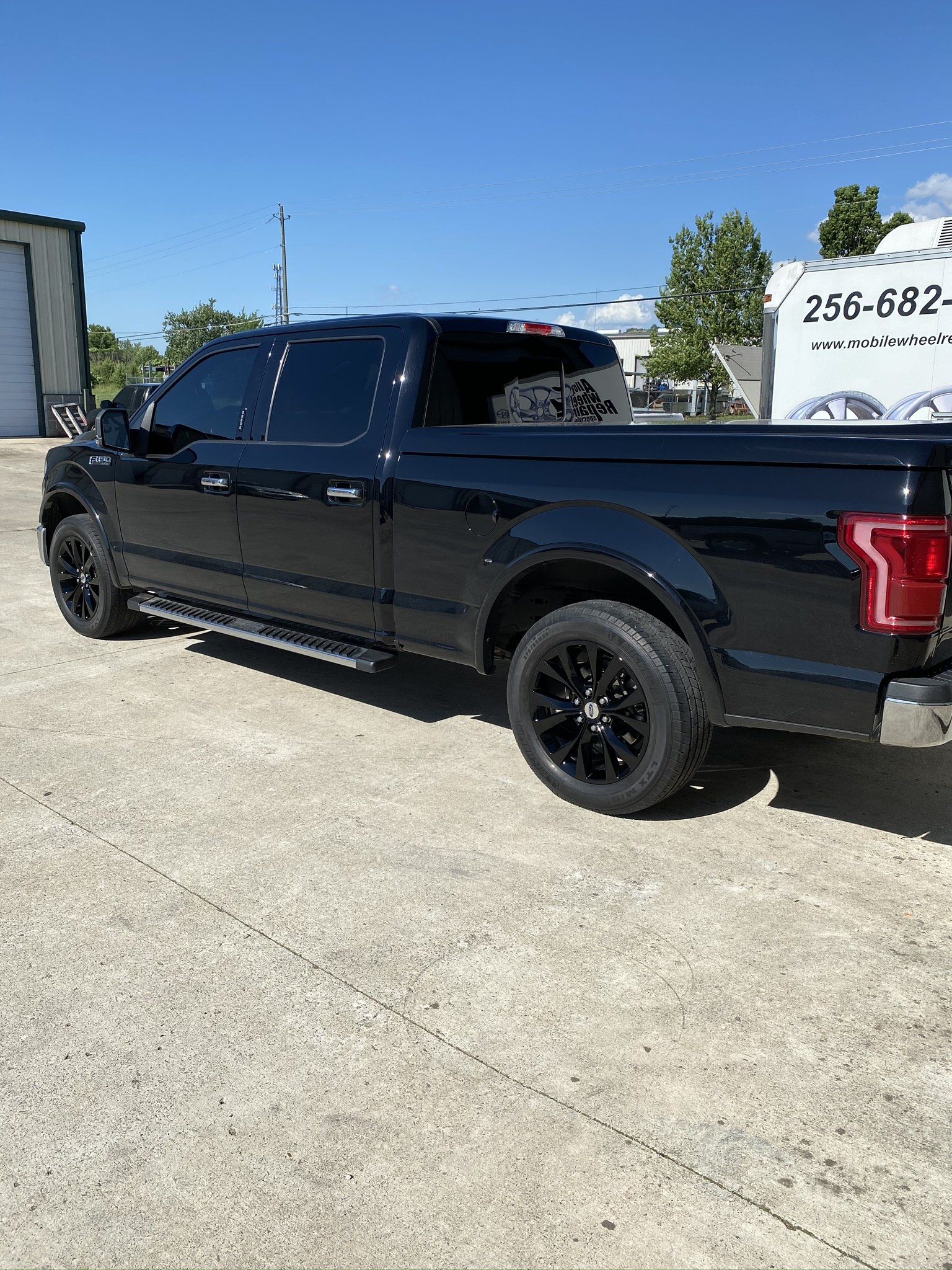 Black pickup truck with new tires