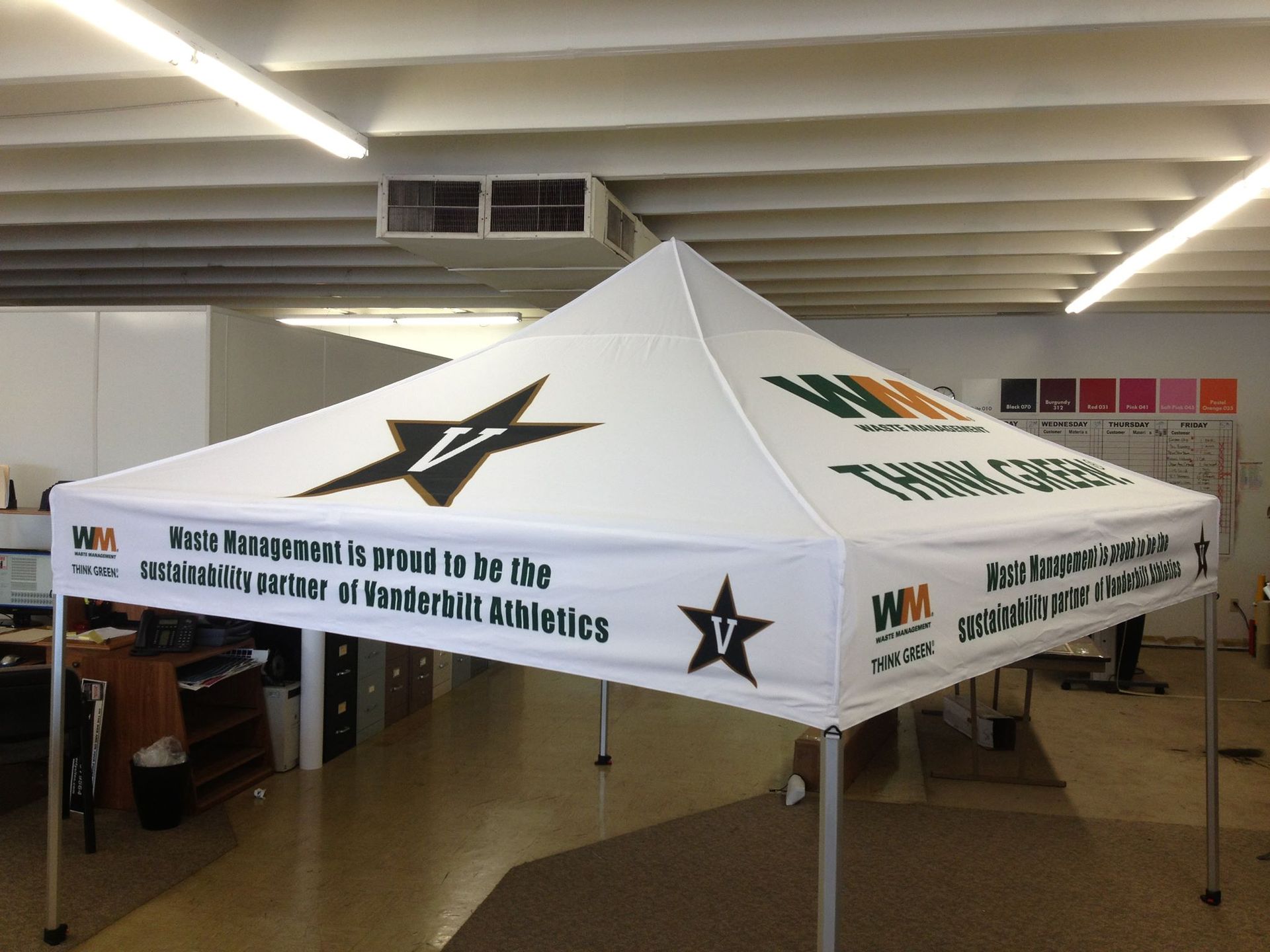 A white tent with a black star and the words 