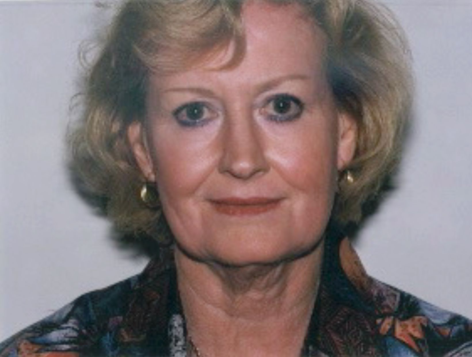 A woman wearing a headband with birds on it