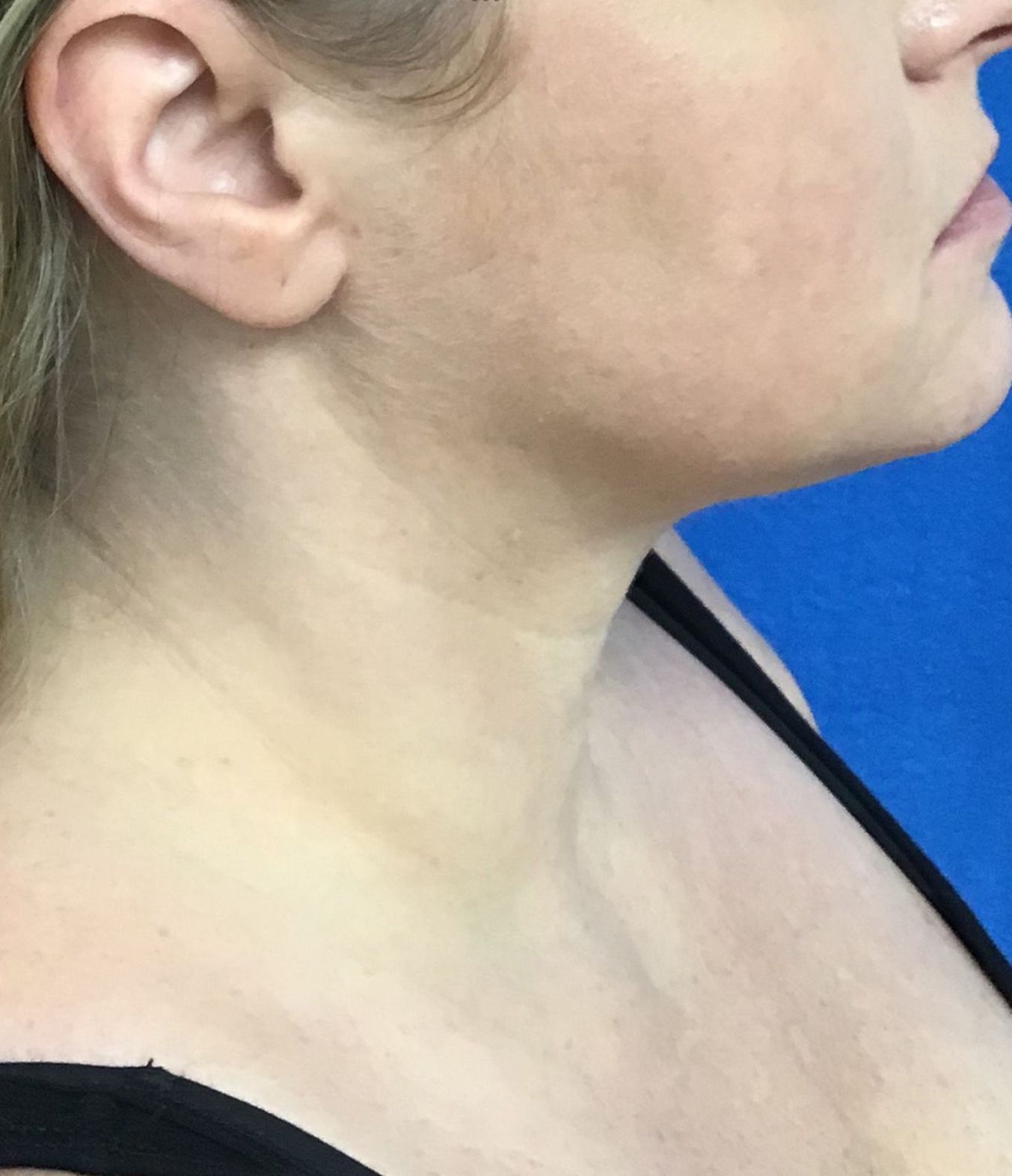 A close up of a woman's neck and ear