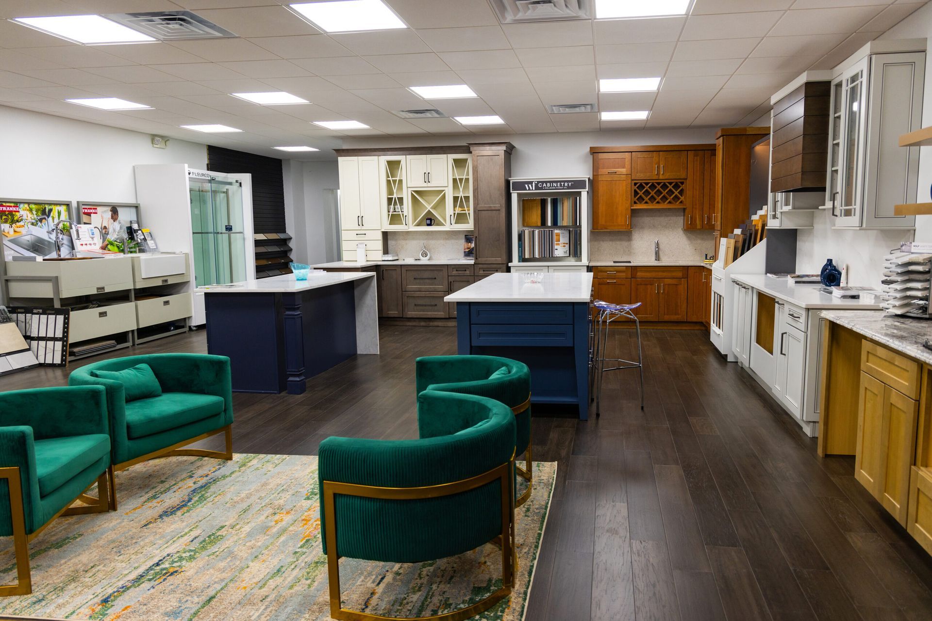 Furniture showroom with green chairs, blue tables, and wood cabinets in a bright store interior