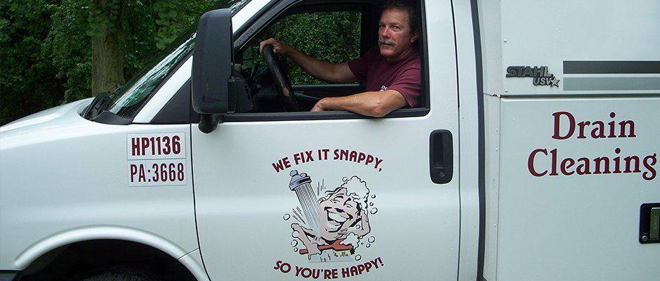 Man in Slaney plumbing van