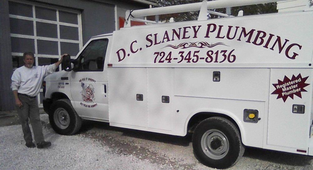Man with slaney plumbing van