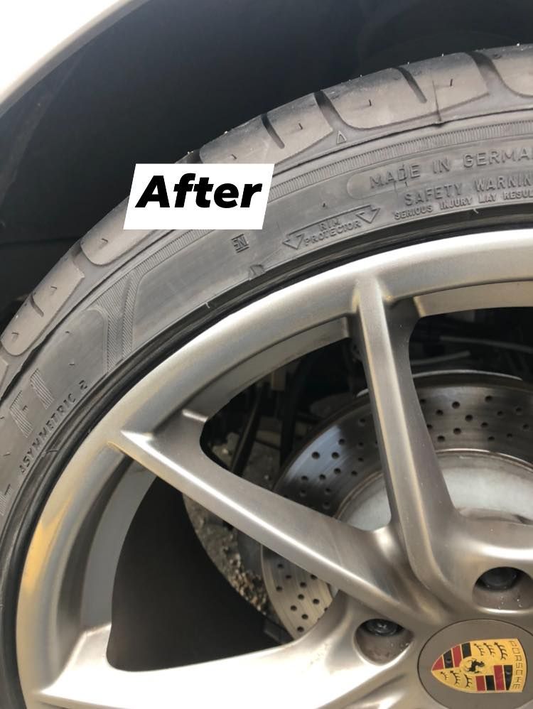 A close up of a porsche wheel after scratch repaired.