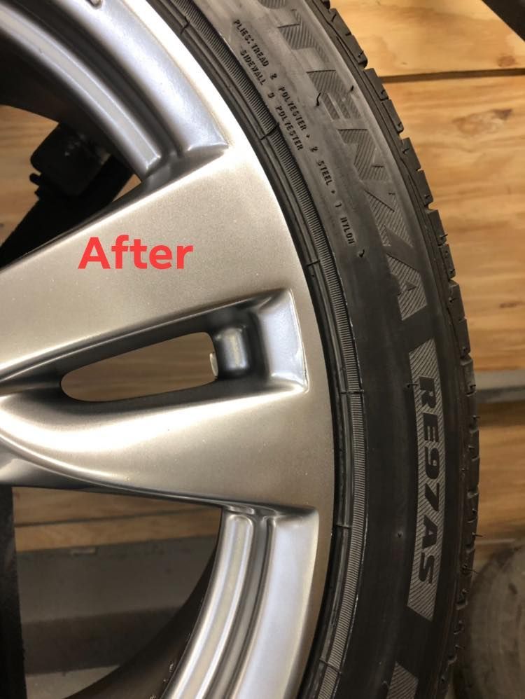 A close up of a tire wheel after scratch repaired.