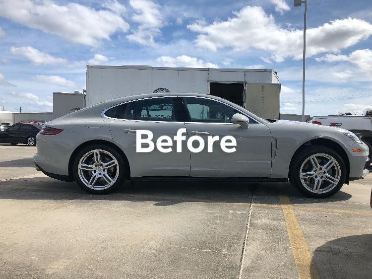 A silver porsche panamera before rim change.