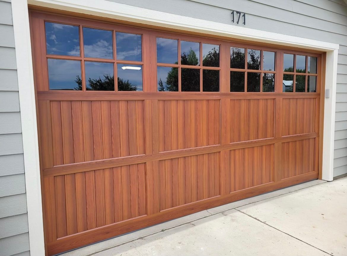 A wooden garage door with the number 371 on it