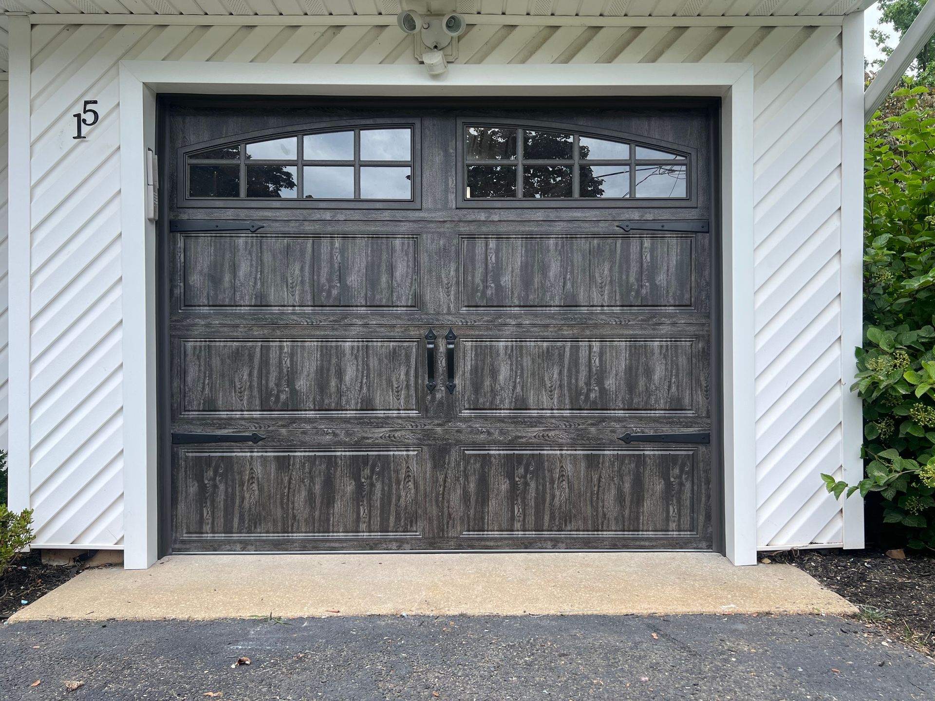 A garage door with the number 15 on it