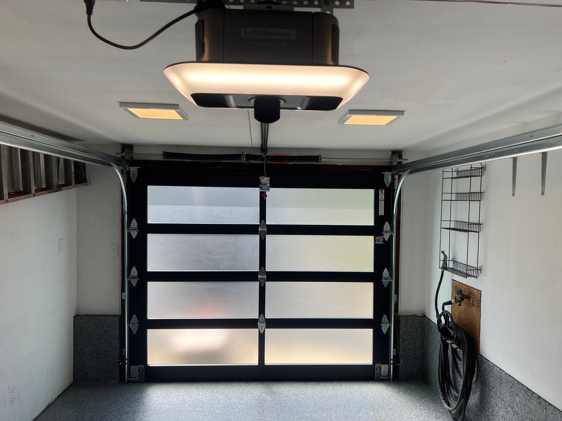 A garage door with a light on top of it