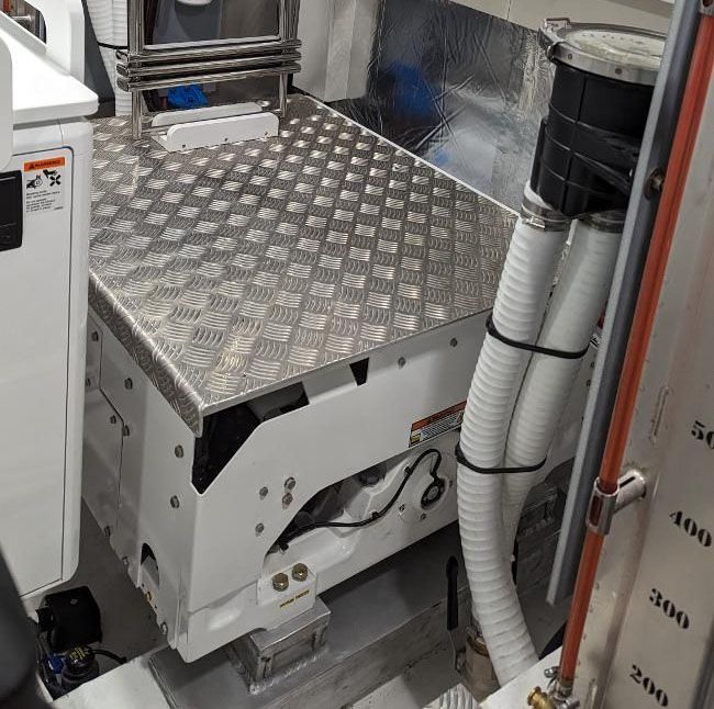 A room with a lot of electrical equipment on a boat.