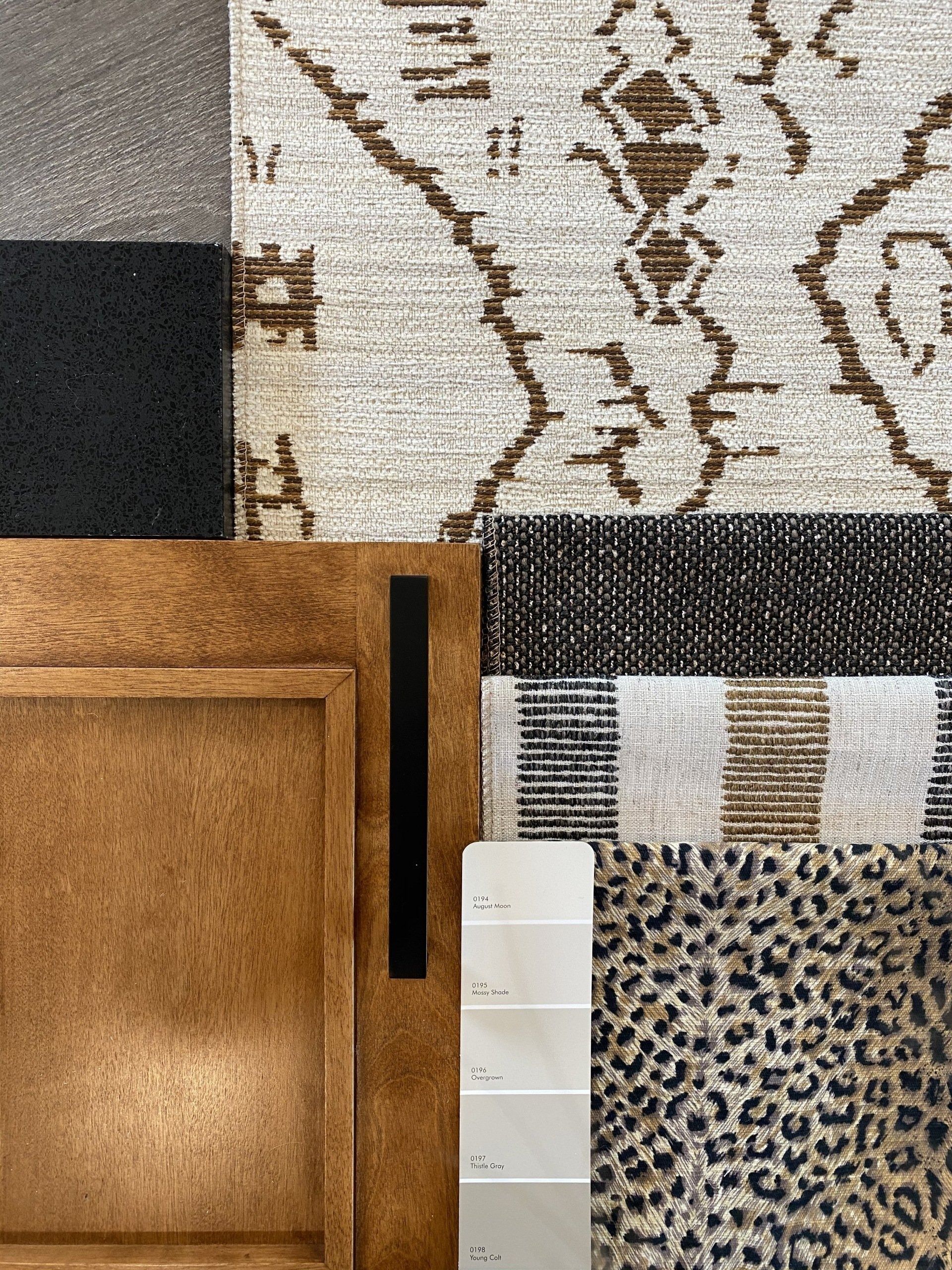 Mood board with neutral tones: wood, textured fabrics, patterned rug, paint swatches, and a leopard print.