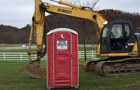 Portable toilet and an excavator