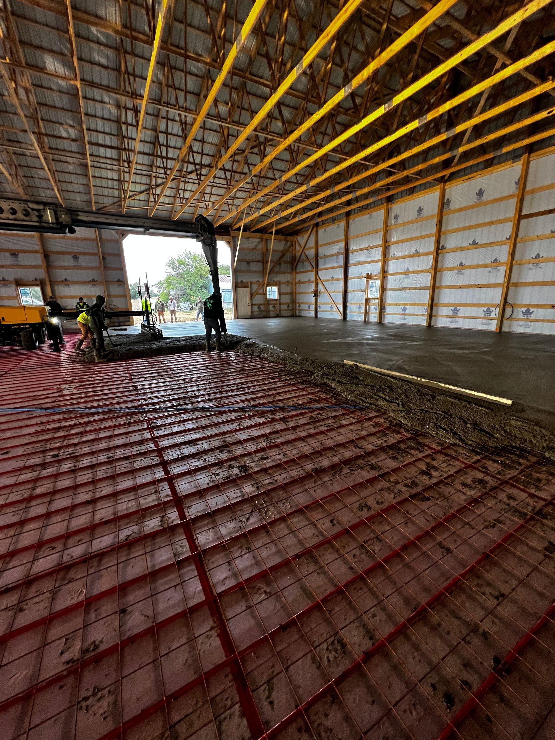 A large building under construction with a concrete floor.