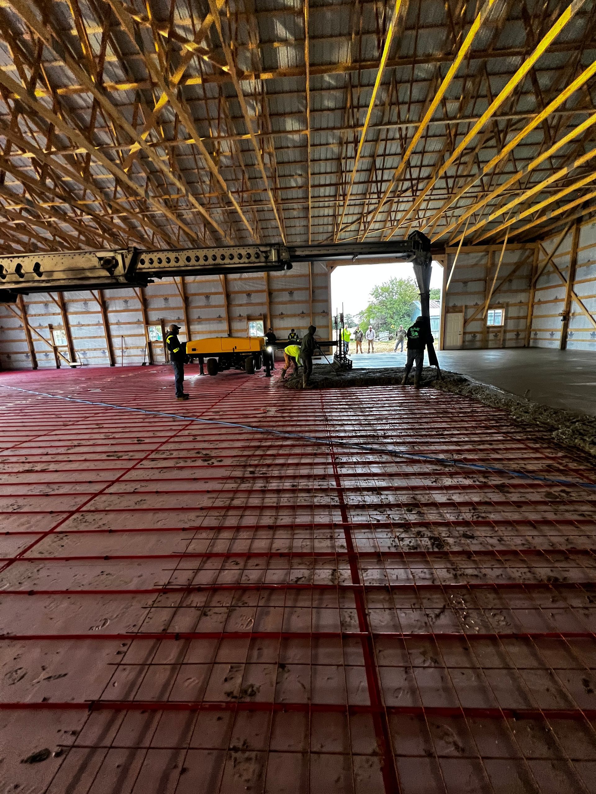 A group of people are working on the floor of a building.