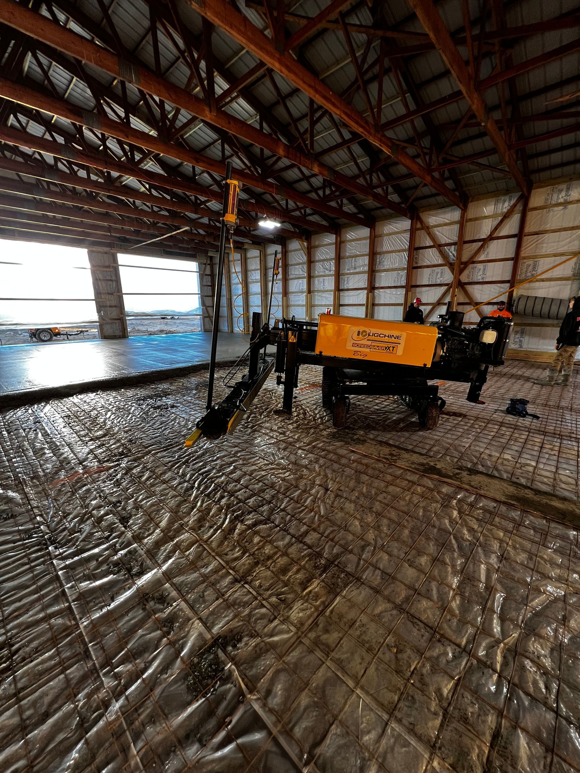 A machine is sitting in the middle of a large building.
