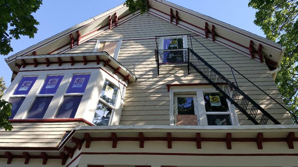 A house with a fire escape on the side of it