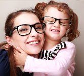 Mother and daughter wearing eyeglasses