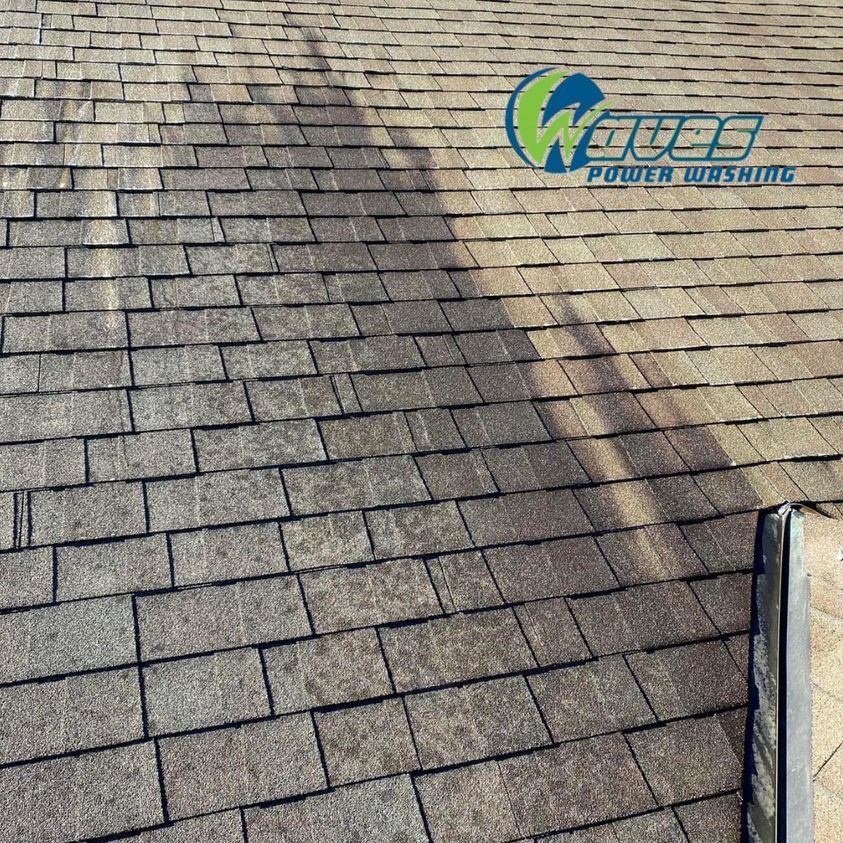 A close up of a roof with a shadow on it.