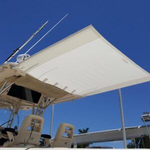 A boat with a large white umbrella on top of it