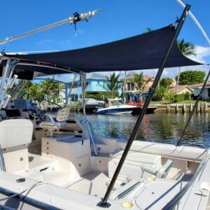 A boat with a black canopy on top of it