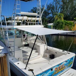 A boat with a large white umbrella on top of it