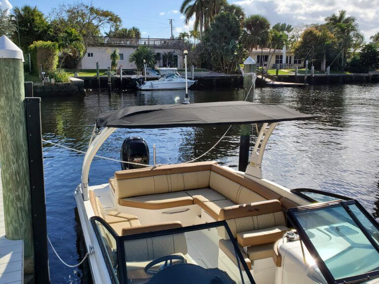 A boat is docked at a dock in the water