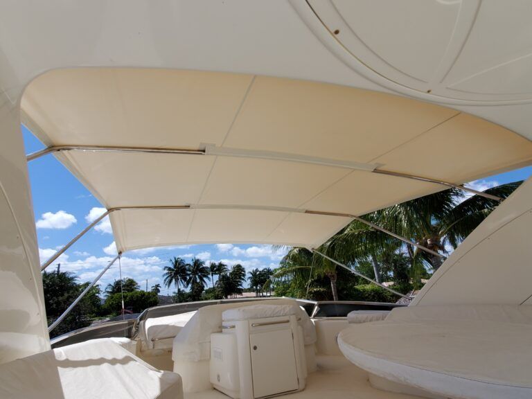 The inside of a boat with a canopy over the cockpit