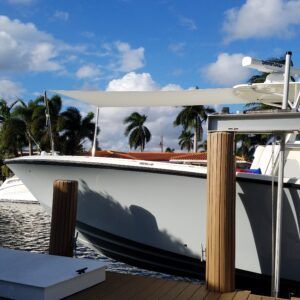 A boat is docked at a dock in the water