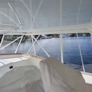 The inside of a boat with a view of the water.