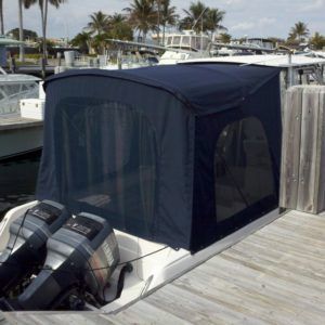 A boat with a blue canopy on top of it