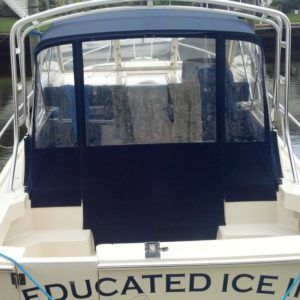 The back of a boat that says educated ice on it