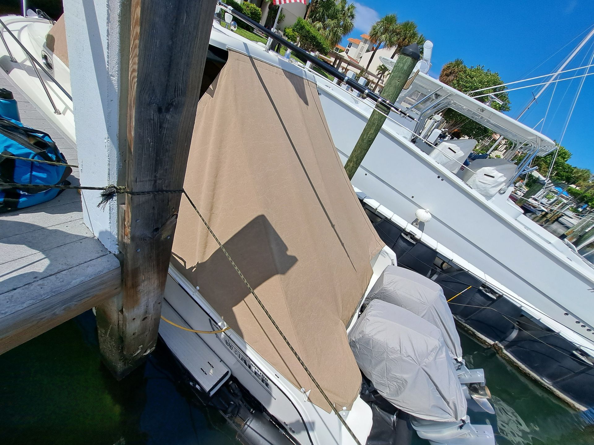A boat is docked at a dock in a marina