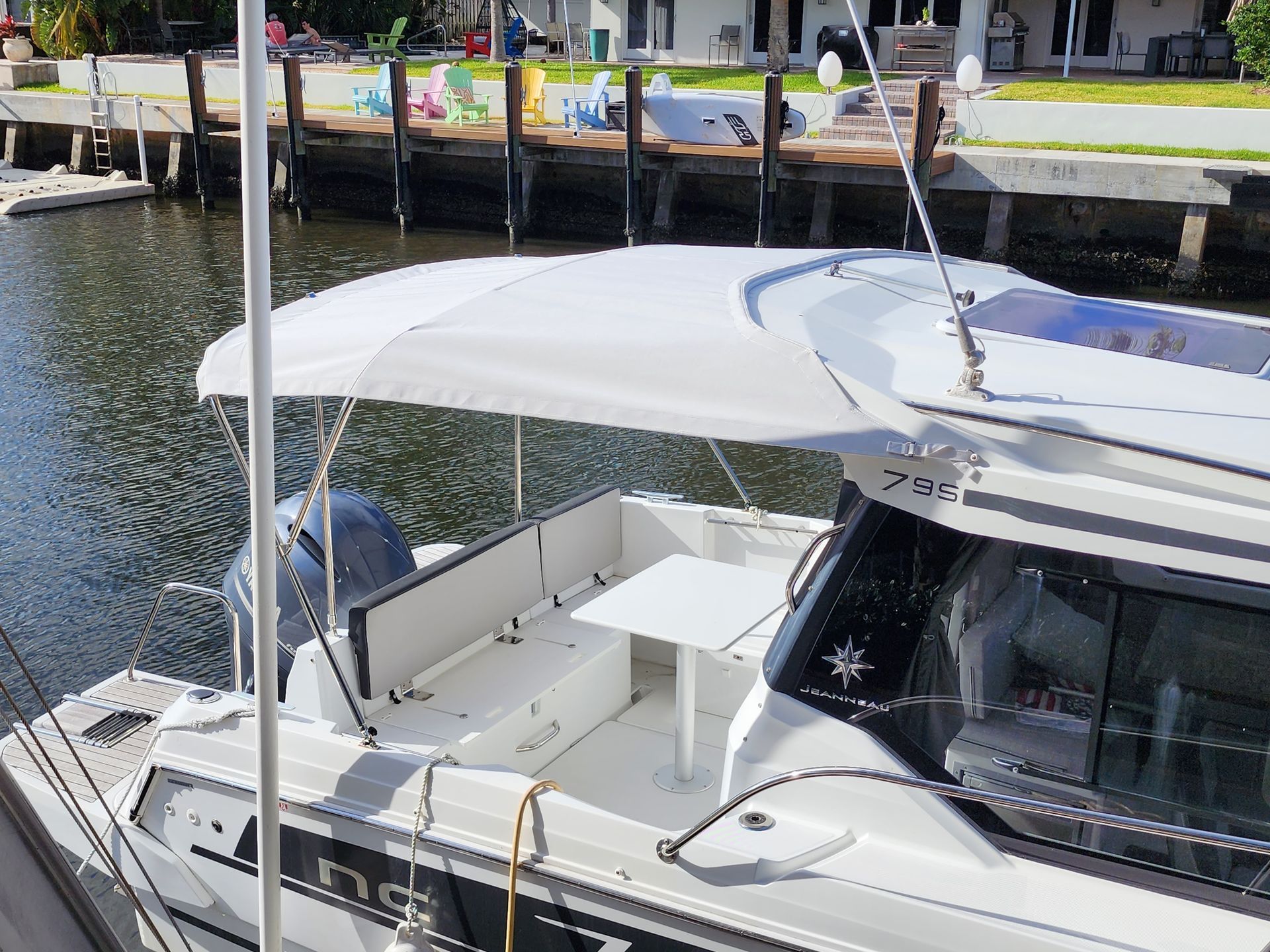 A boat with a white canopy on top of it