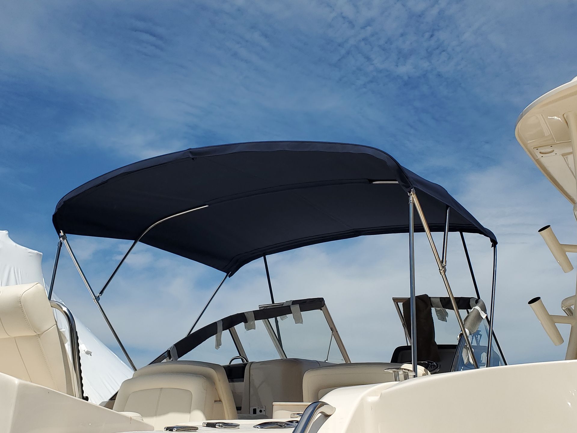 A boat with a blue canopy on top of it