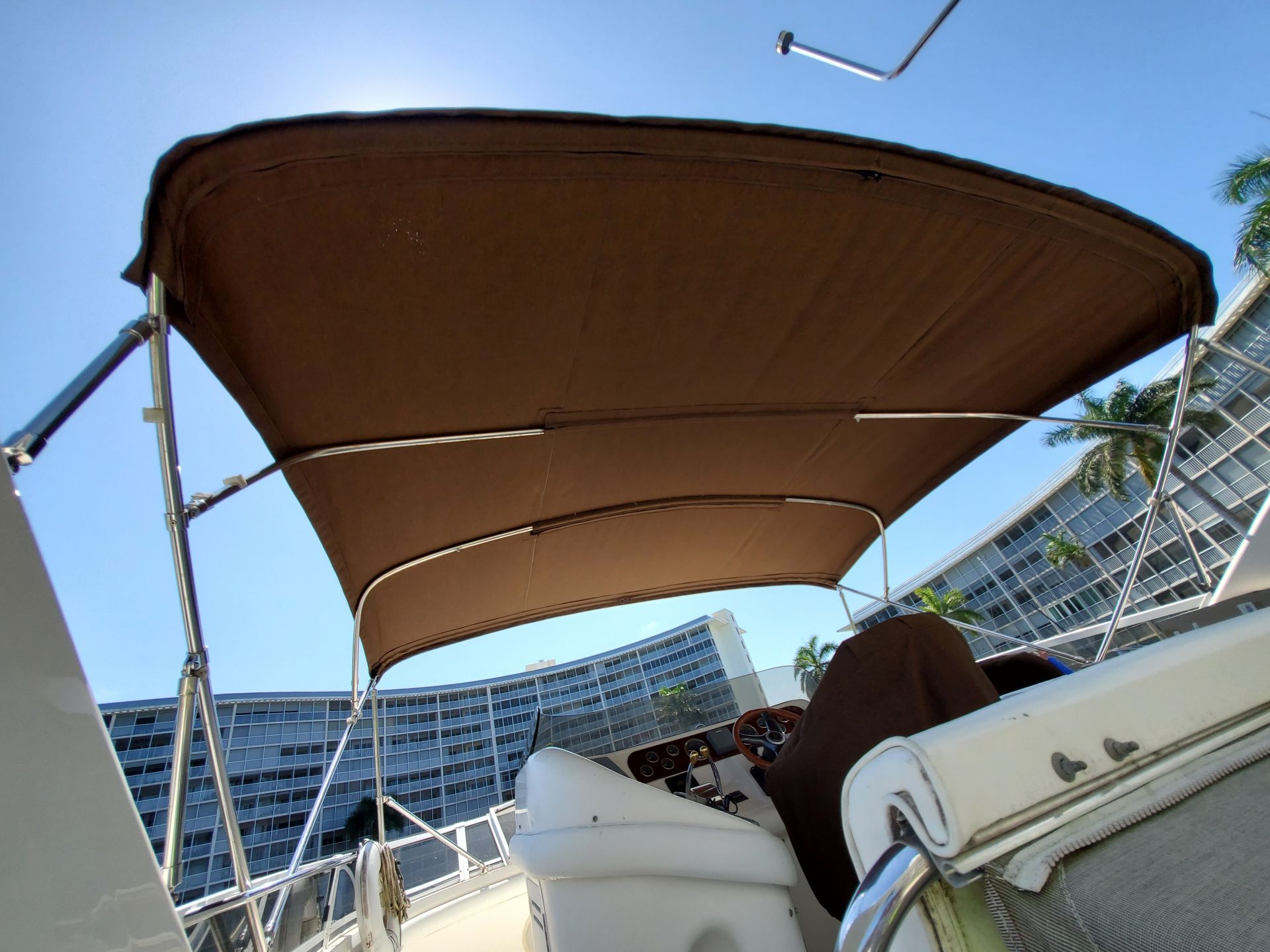 A boat with a brown canopy on top of it