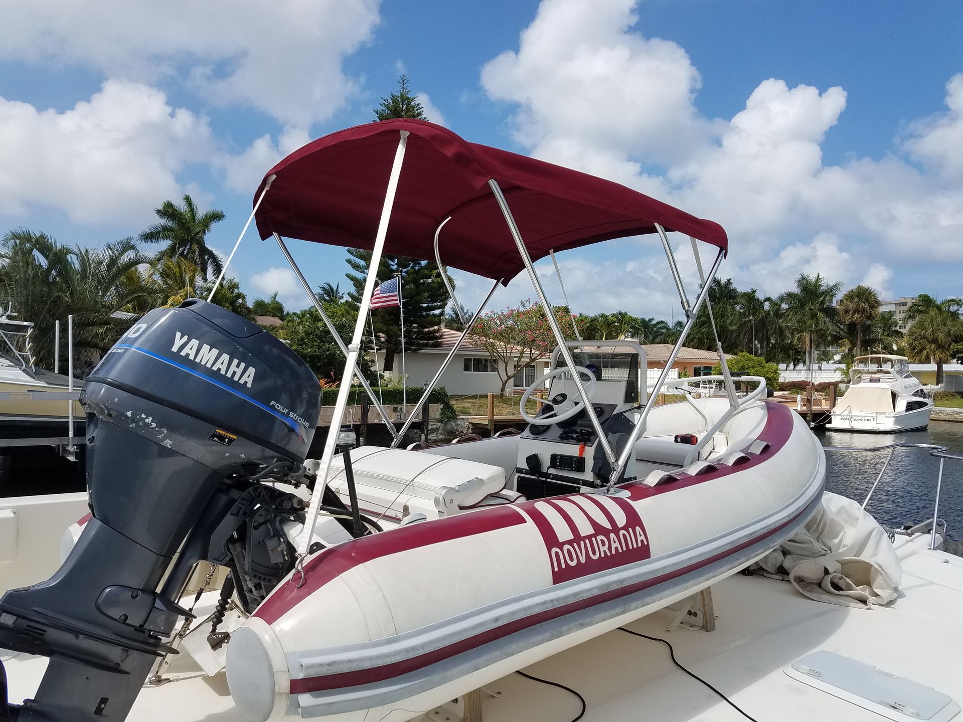 A boat with a yamaha engine is docked in a marina